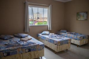 Postel nebo postele na pokoji v ubytování Hotel Santo Afonso + 49 fotografií