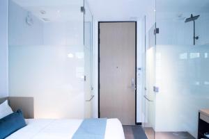 Postel nebo postele na pokoji v ubytování Hotel NuVe Elements