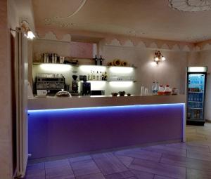 a kitchen with a purple bar in a room at Hotel La Valle dell'Aquila in LʼAquila