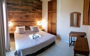 Postel nebo postele na pokoji v ubytování Anemos Hotel