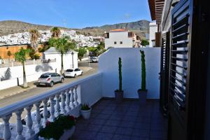 a balcony with a view of a street at Lagaete Duplex in Agaete