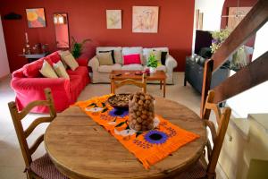 a living room with a wooden table and a couch at Lagaete Duplex in Agaete