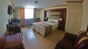 Postel nebo postele na pokoji v ubytování Hotel Oro Inn