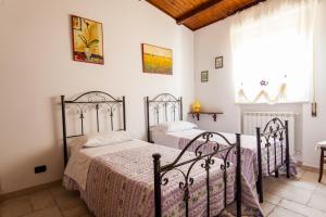 a bedroom with two beds and a window at Villa Marida in Gioia del Colle +85 photos