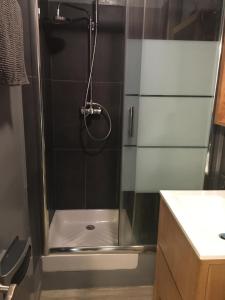 a shower with a glass door in a bathroom at Cassis et ses trésors in Cassis +21 photos