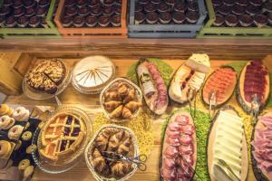 a display of different types of food in baskets at Serendipity Hotel in Sauze dʼOulx