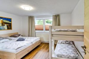 Postel nebo postele na pokoji v ubytování Ferienwohnung Ellmerer