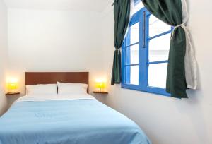 Letto o letti in una camera di Granada Hostel