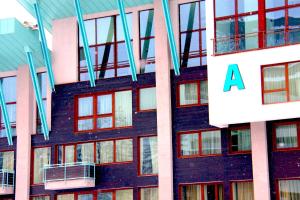 a building with aaa sign on the side of it at Silver Mountain in Poiana Brasov