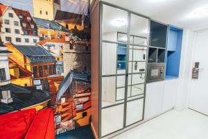 Kuchyň nebo kuchyňský kout v ubytování Cities Gallery Apart-hotel