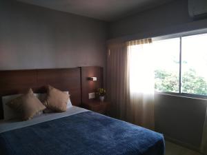 
Кровать или кровати в номере Hotel Tower House Suites
