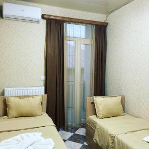 Postel nebo postele na pokoji v ubytování Apart Hotel 25