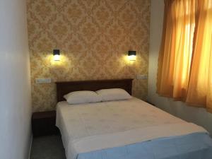 Postel nebo postele na pokoji v ubytování Sea Sands Beach Hostel