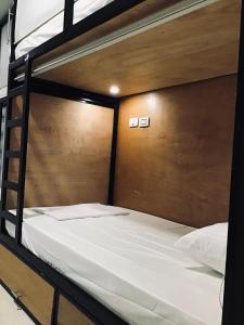 Letto o letti in una camera di Nueve Uno Hostel
