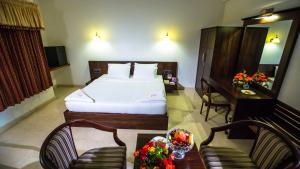 Postel nebo postele na pokoji v ubytování Lakshmi Hotel + 37 fotografií