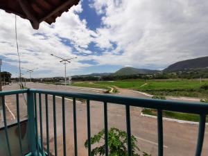 a balcony with a view of a road and mountains at Hilton Hotel in Barra do Garças
