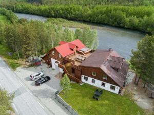 an aerial view of a house with a car parked in front at Reisa Lodge in Storslett
