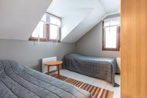 Postel nebo postele na pokoji v ubytování Miekojärvi Resort + 37 fotografií