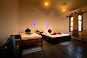 מיטה או מיטות בחדר ב-The Surf Access Guest House