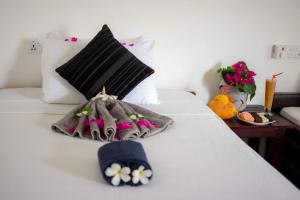 מיטה או מיטות בחדר ב-The Surf Access Guest House