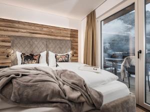 Posteľ alebo postele v izbe v ubytovaní Platzhirsch Apart & Mayrhofen