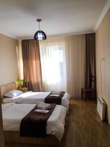 Postel nebo postele na pokoji v ubytování Family Hotel Kala + 30 fotografií