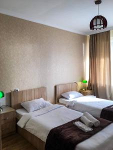 Postel nebo postele na pokoji v ubytování Family Hotel Kala