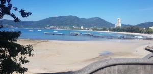 a view of a beach with boats in the water at Sky Silk Decoration House in Patong Beach
