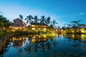 a view of the resort at night at Zest Resort & Spa Hoi An in Hoi An