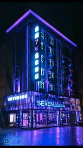 a building with blue and purple lights on it at Seven Fukun Hotel in Jiaoxi
