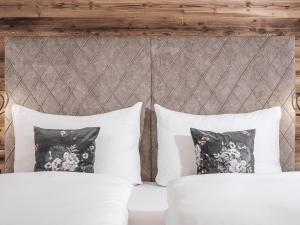 Posteľ alebo postele v izbe v ubytovaní Platzhirsch Apart & Mayrhofen