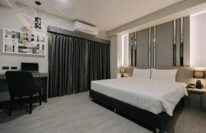 Postel nebo postele na pokoji v ubytování Arista Hotel Ubon