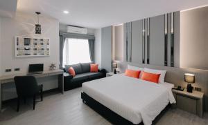 Postel nebo postele na pokoji v ubytování Arista Hotel Ubon