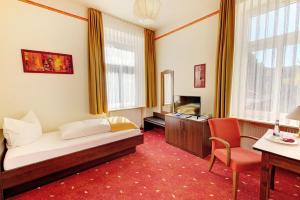 TV a/nebo společenská místnost v ubytování Hotel Fidelitas