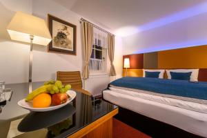 Postel nebo postele na pokoji v ubytování MAXMILLIAN Pension & Restaurant