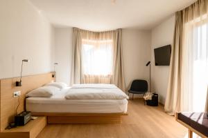 Calva B&B Apartments tesisinde bir odada yatak veya yataklar