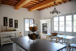 a kitchen with a table and a dining room at Poggio Alle Lame in Tavarnelle in Val di Pesa
