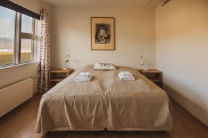 Postel nebo postele na pokoji v ubytování Framtid Apartments and Holiday Homes