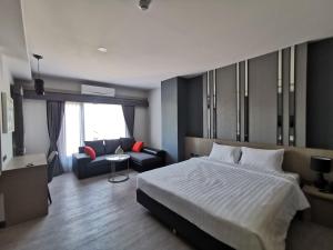 Postel nebo postele na pokoji v ubytování Arista Hotel Ubon