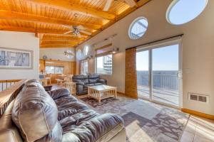 a living room with a couch and a table at Grey Haven in Rockaway Beach