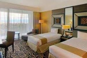 Postelja oz. postelje v sobi nastanitve Bela International Hotel & ConventionTernate
