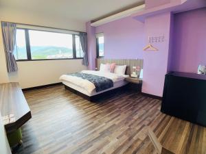 Cama o camas de una habitación en 旭語民宿 台東縣民宿1436號