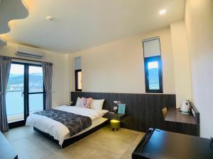 Cama o camas de una habitación en 旭語民宿 台東縣民宿1436號
