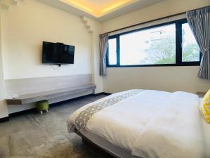 Cama o camas de una habitación en 旭語民宿 台東縣民宿1436號