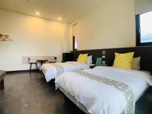 Cama o camas de una habitación en 旭語民宿 台東縣民宿1436號