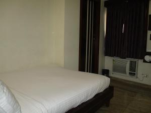 Postel nebo postele na pokoji v ubytování Hotel Sapna