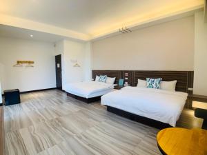 Cama o camas de una habitación en 旭語民宿 台東縣民宿1436號