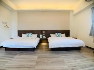Cama o camas de una habitación en 旭語民宿 台東縣民宿1436號