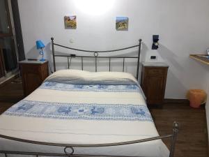 Tempat tidur dalam kamar di Antica Potecarìa