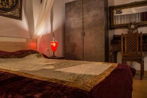 Postel nebo postele na pokoji v ubytování Dharma Luxury & Spa Apartment